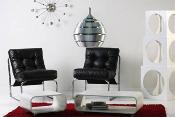 Fauteuil lounge 'Capiton' noir pieds en métal chromé